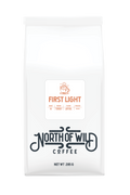 First Light is a light roast blend that captures the quiet magic of early morning.